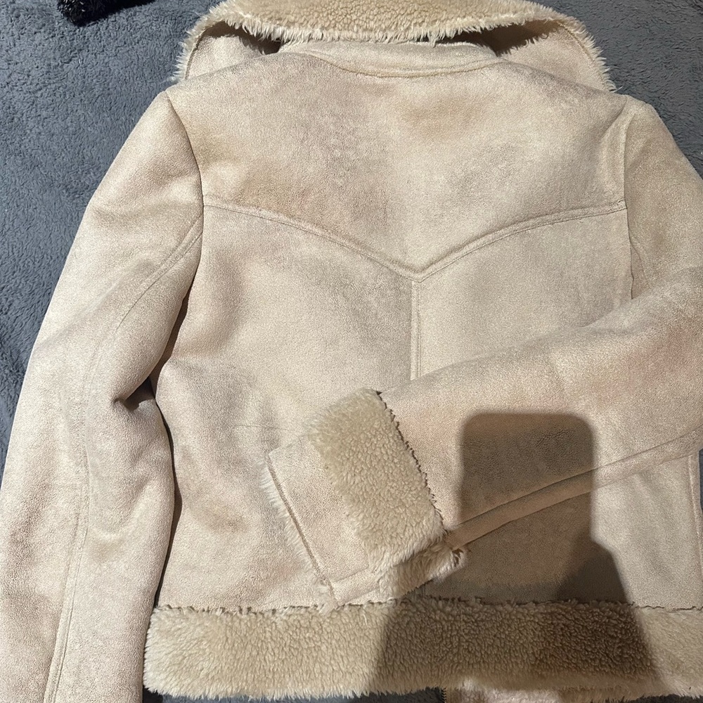 Mother light beige jacket.